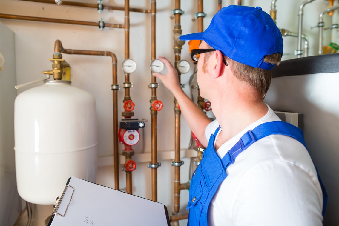 Engineer Controlling the Heating System